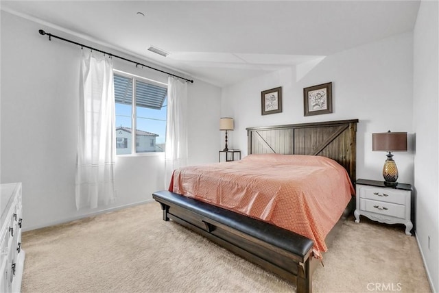 bedroom with light colored carpet