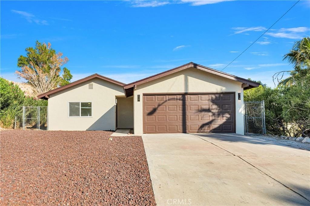 ranch-style home featuring a garage