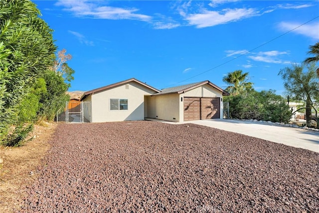 single story home featuring a garage