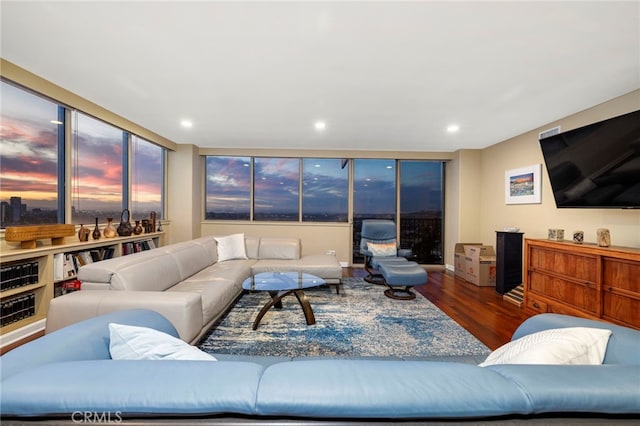 living area with recessed lighting and wood finished floors