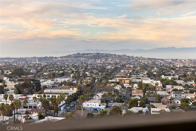 property's view of city with a mountain view