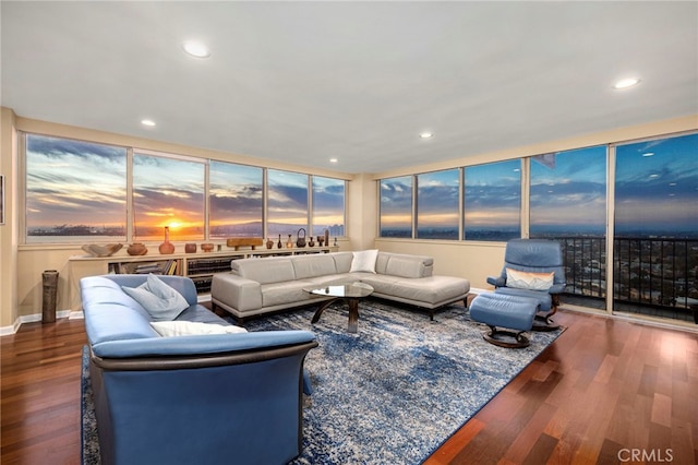 living area with recessed lighting and wood finished floors