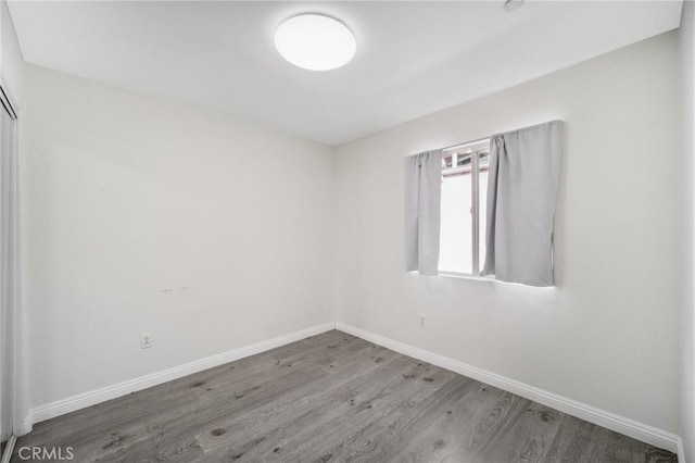 empty room featuring hardwood / wood-style floors