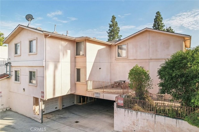 rear view of house with a garage