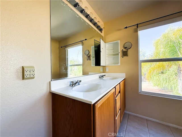 bathroom with vanity and tile patterned flooring