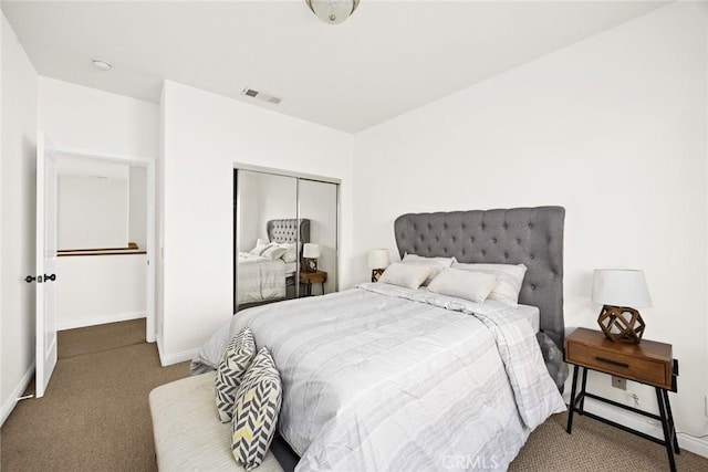 carpeted bedroom featuring a closet