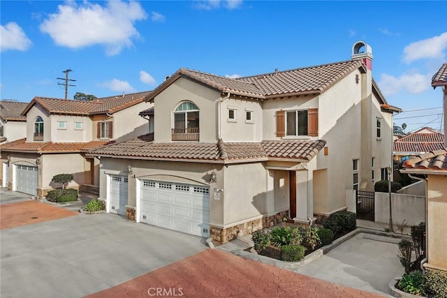 mediterranean / spanish house featuring a garage