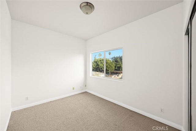 unfurnished room featuring carpet floors