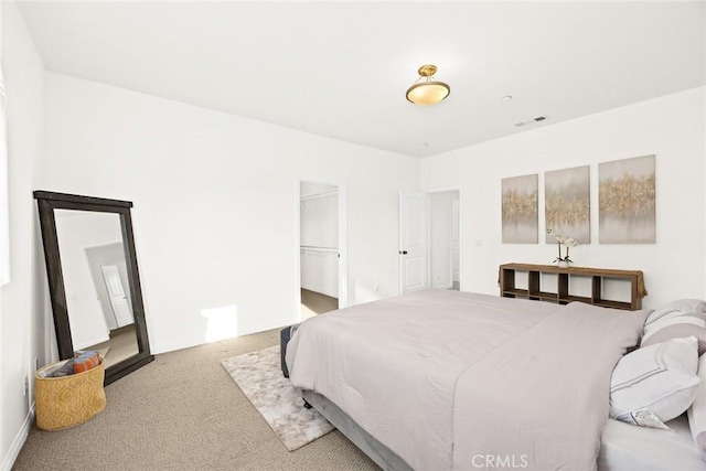 bedroom with light colored carpet