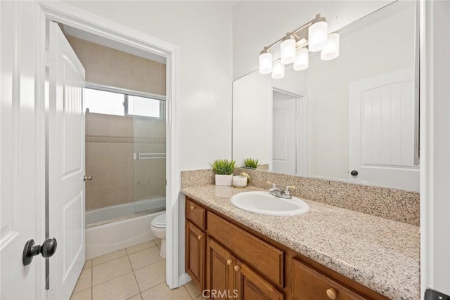 full bathroom featuring vanity, tile patterned floors, enclosed tub / shower combo, and toilet