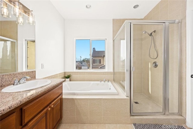 bathroom with tile patterned floors, vanity, and plus walk in shower