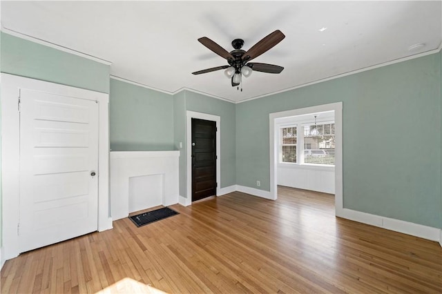 interior space featuring ornamental molding, ceiling fan, and light hardwood / wood-style floors