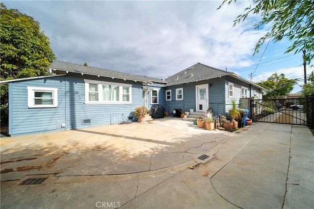 back of house with a patio