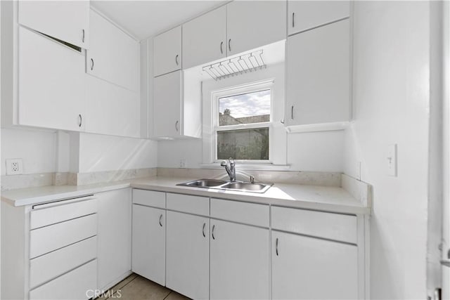 kitchen with sink and white cabinets