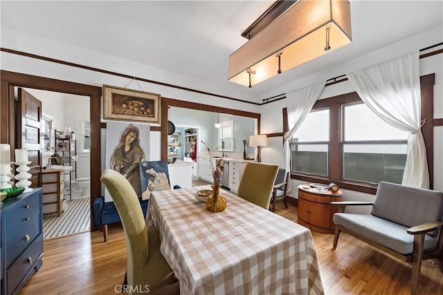 dining area with light wood-type flooring