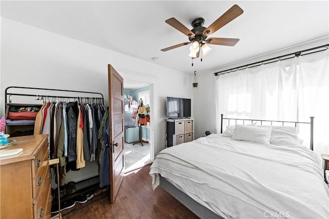 bedroom with dark wood-type flooring and ceiling fan