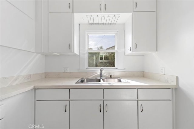 kitchen with sink and white cabinets