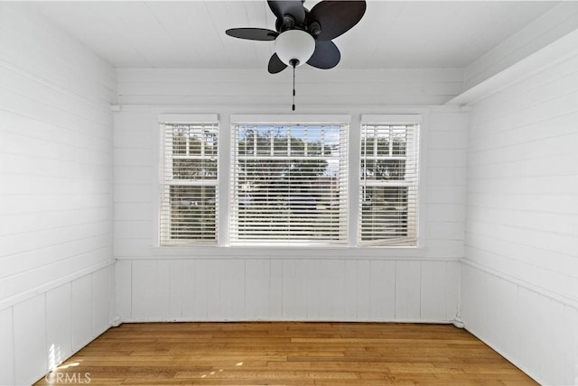 spare room with light hardwood / wood-style flooring and ceiling fan