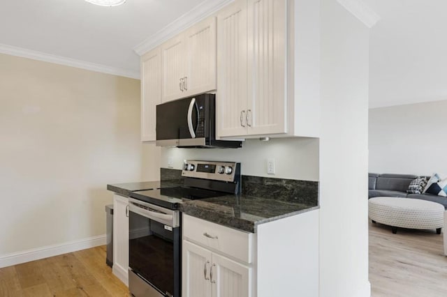 kitchen featuring white cabinetry, electric range, and ornamental molding