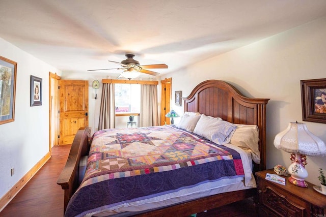 bedroom featuring dark hardwood / wood-style flooring and ceiling fan