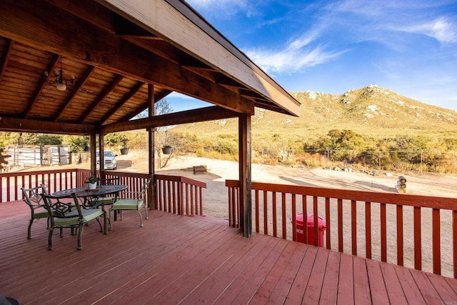 wooden deck with a mountain view