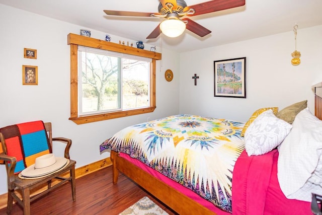 bedroom featuring hardwood / wood-style floors and ceiling fan