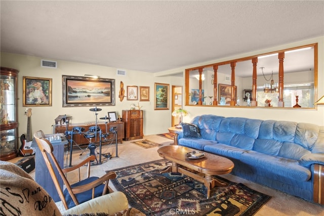 living room with a textured ceiling and carpet flooring