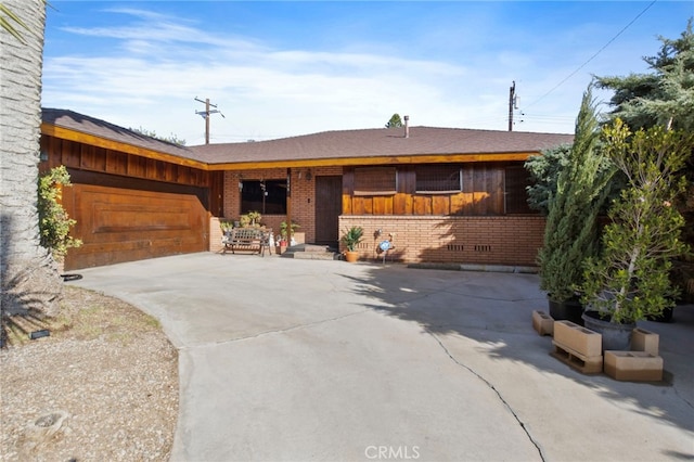 single story home with a garage