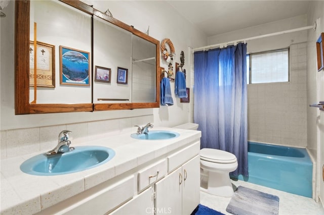 full bathroom featuring vanity, toilet, and shower / bath combo