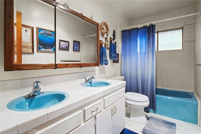 full bathroom with vanity, shower / bath combination with curtain, and toilet