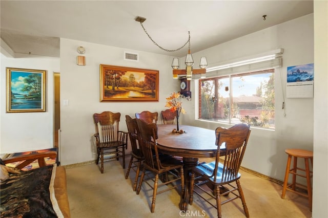 dining area with light colored carpet