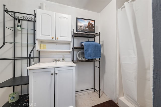 laundry area with sink and light tile patterned floors