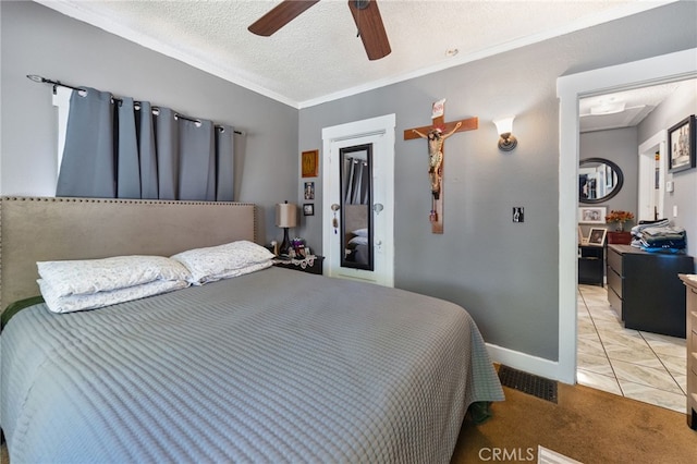 bedroom featuring crown molding, light colored carpet, ceiling fan, and a textured ceiling