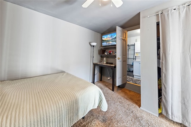 bedroom with vaulted ceiling, light colored carpet, and ceiling fan