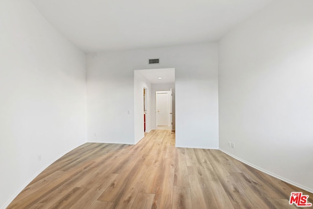 spare room featuring light hardwood / wood-style floors