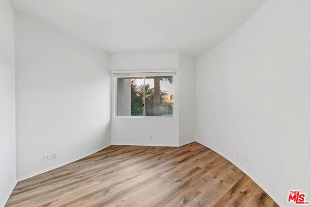 spare room featuring light hardwood / wood-style floors