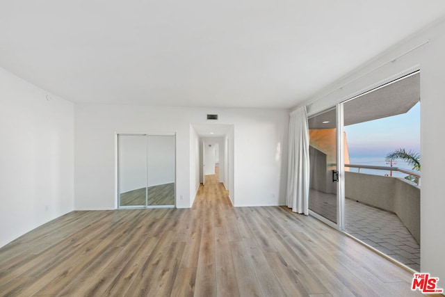 unfurnished room featuring light hardwood / wood-style floors