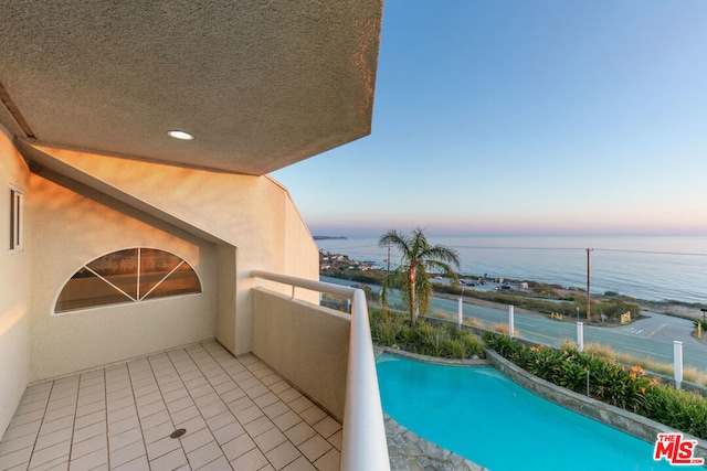 balcony at dusk with a water view