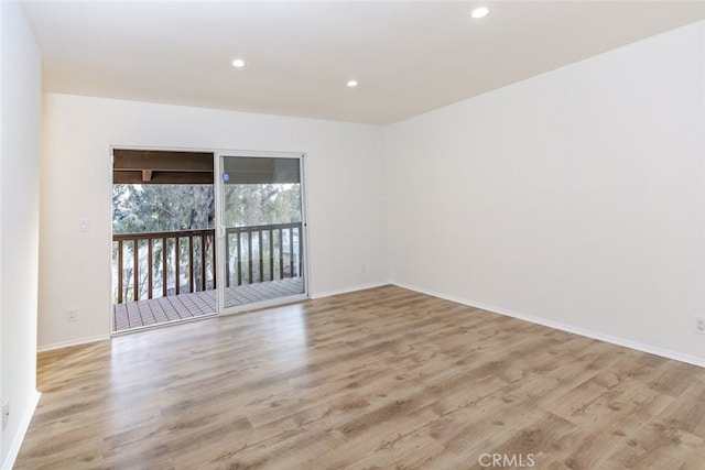 unfurnished room with light hardwood / wood-style flooring