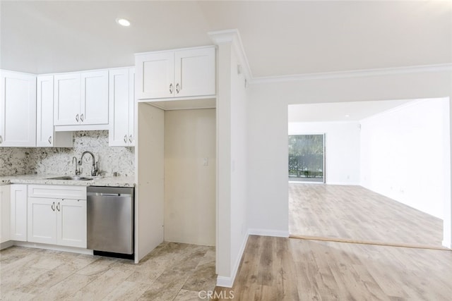 kitchen with sink, white cabinetry, stainless steel dishwasher, ornamental molding, and decorative backsplash