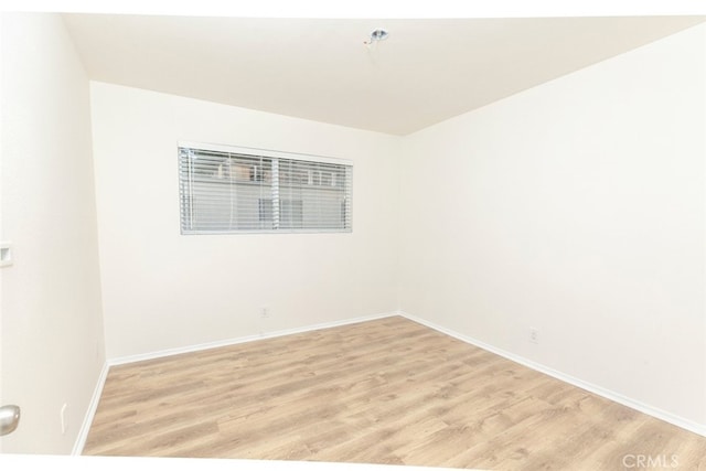 spare room with light hardwood / wood-style floors