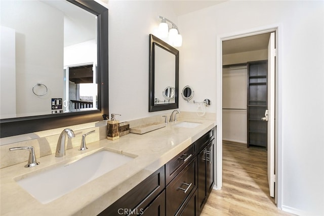 bathroom featuring vanity and hardwood / wood-style flooring