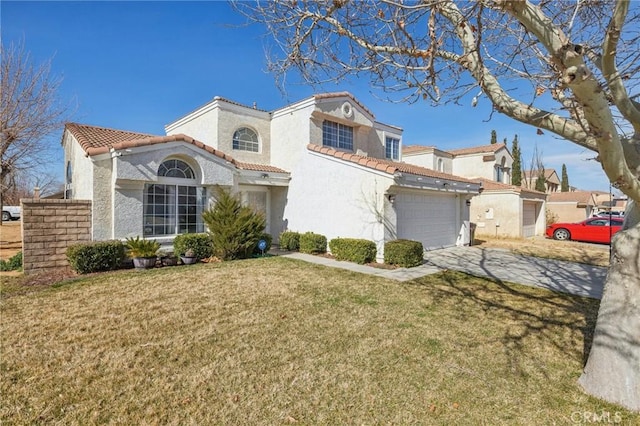 view of front facade featuring a garage and a front lawn