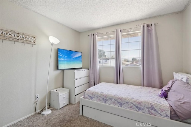 carpeted bedroom featuring a textured ceiling