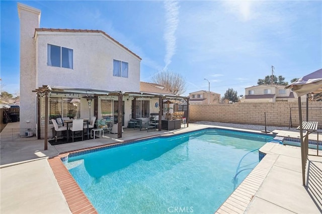 view of pool with a patio and a pergola