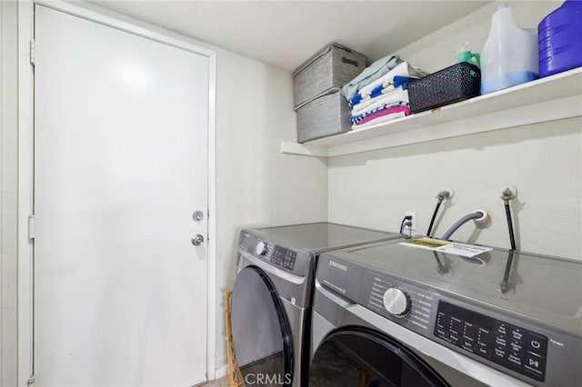 clothes washing area featuring washing machine and clothes dryer