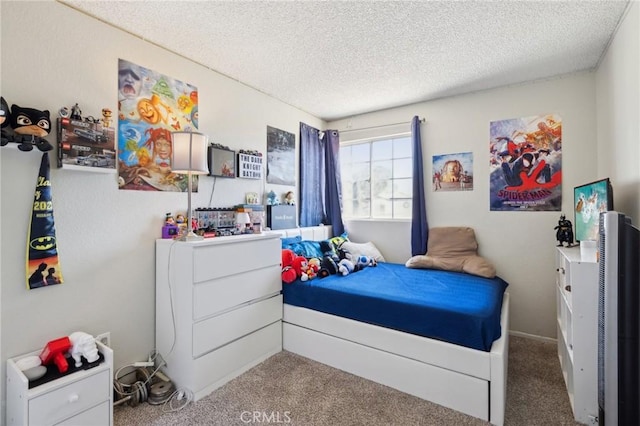 bedroom with carpet and a textured ceiling