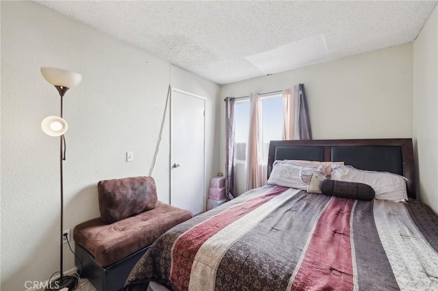 bedroom featuring a textured ceiling