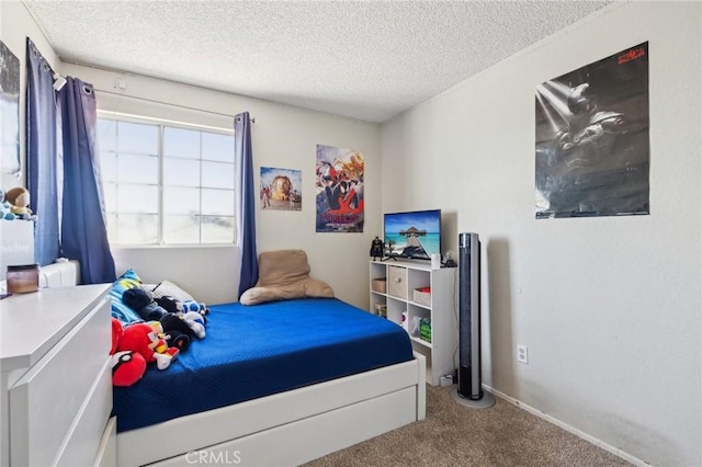 bedroom featuring carpet and a textured ceiling