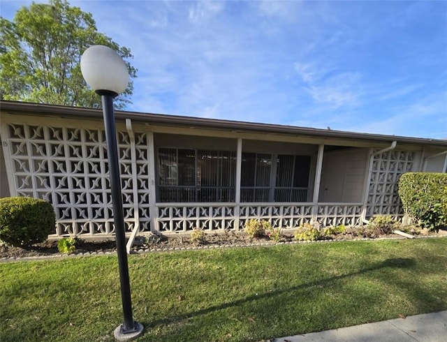 exterior space with a front lawn